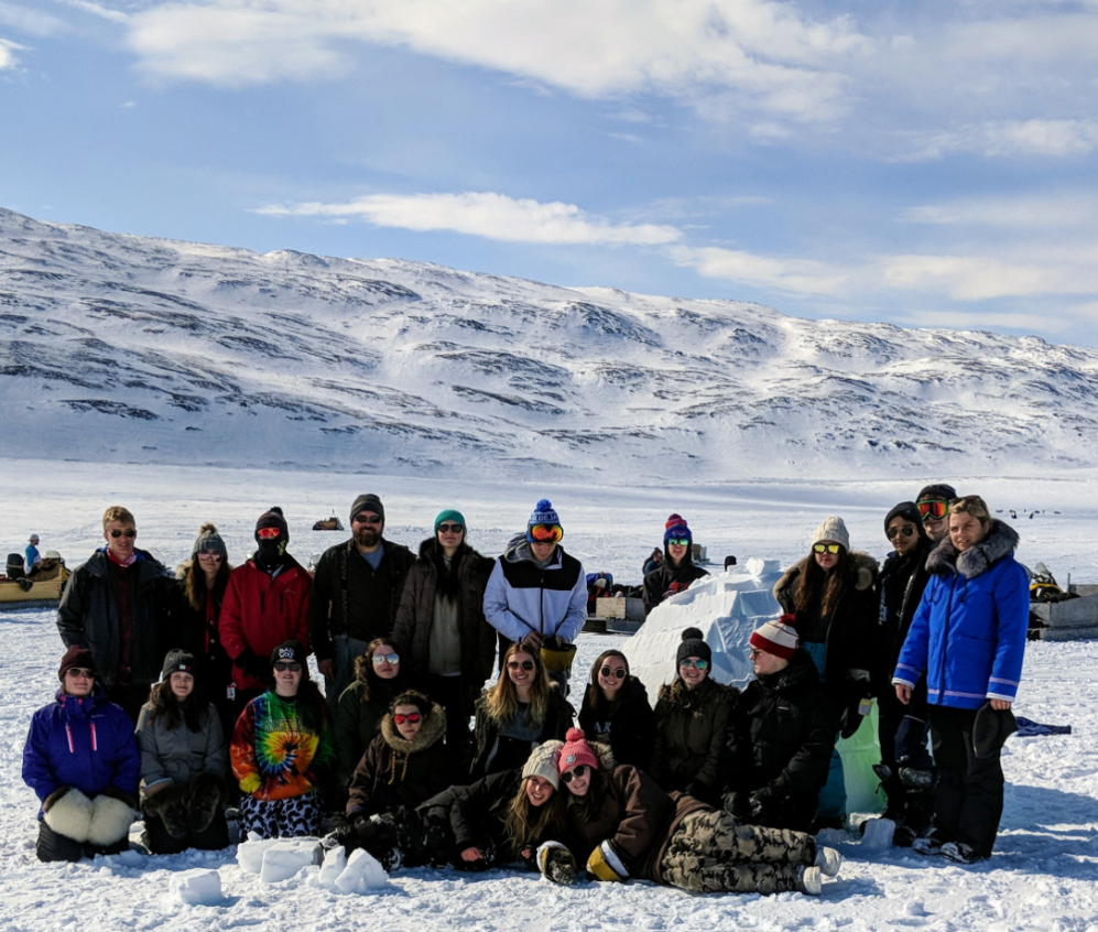 a group of high school students on a snowy mountain top